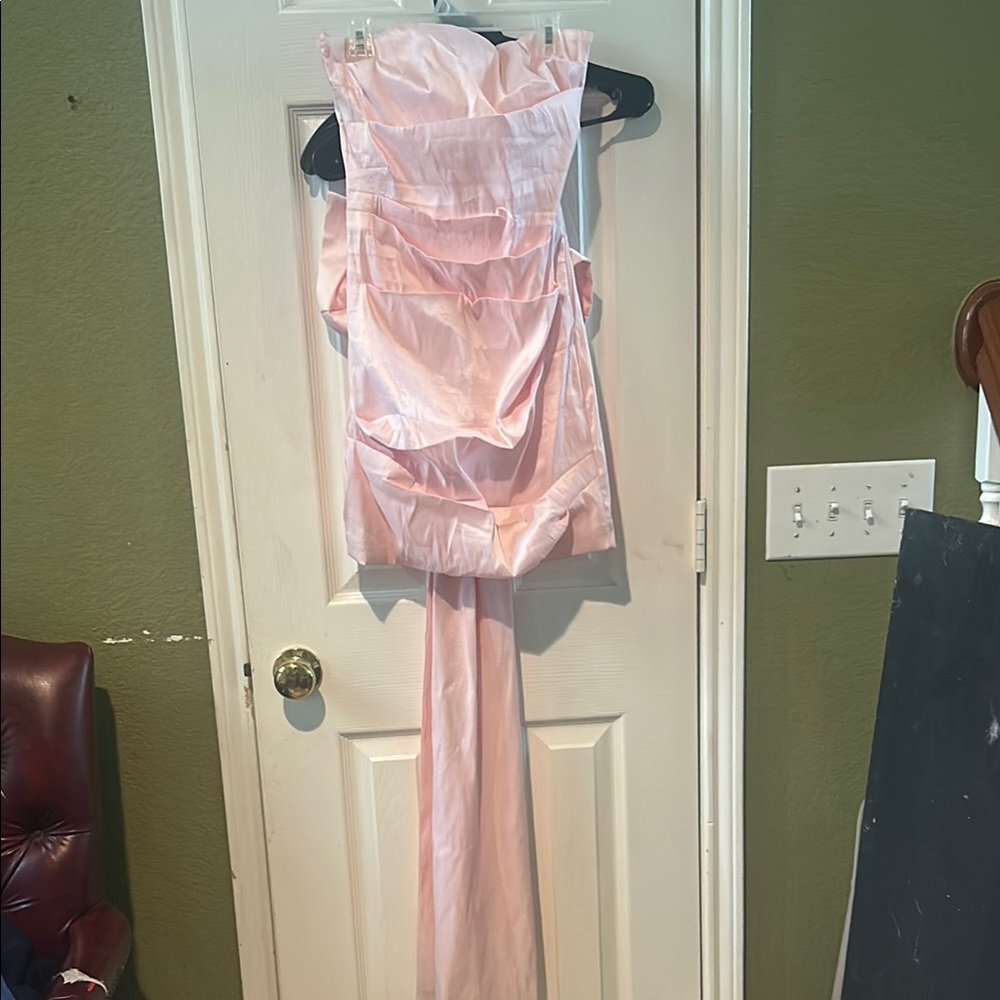 Elegant Pink Strapless Gown with big bow in the back.